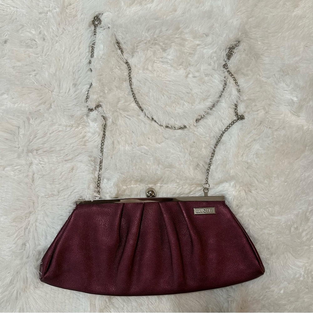 Miche Metallic Berry Clutch with a silver chain handle maroon crossbody purse
